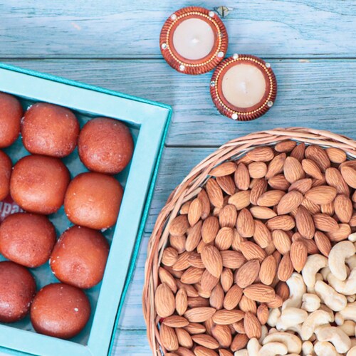 Diyas and sweets with dry fruits combo